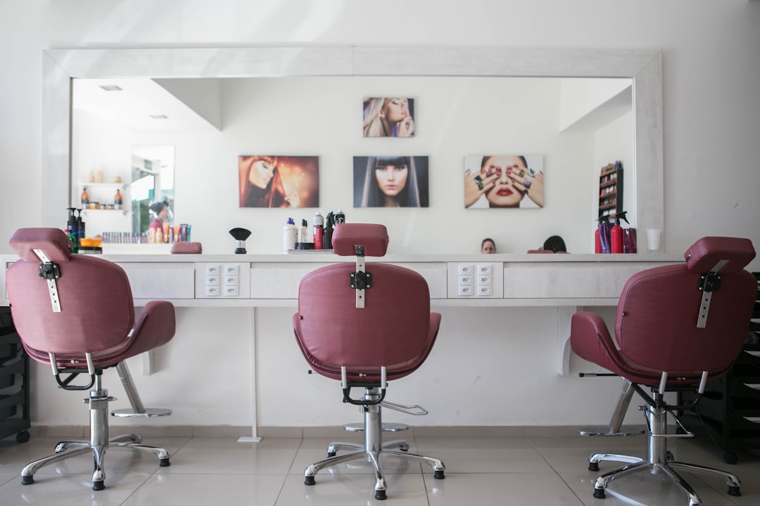 Three maroon salon chairs